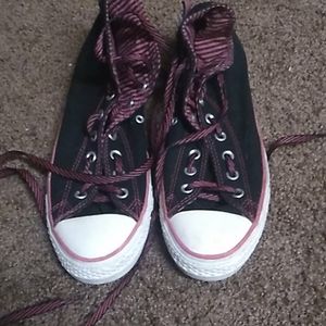 Pink and black converse
